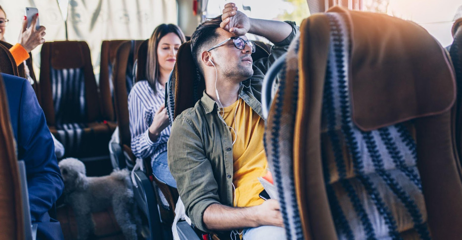 Men seating in bus traveling